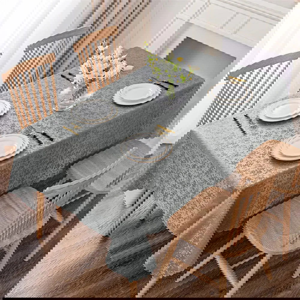 Nappe anti-tâche en polyester enduit gris motif fleuri