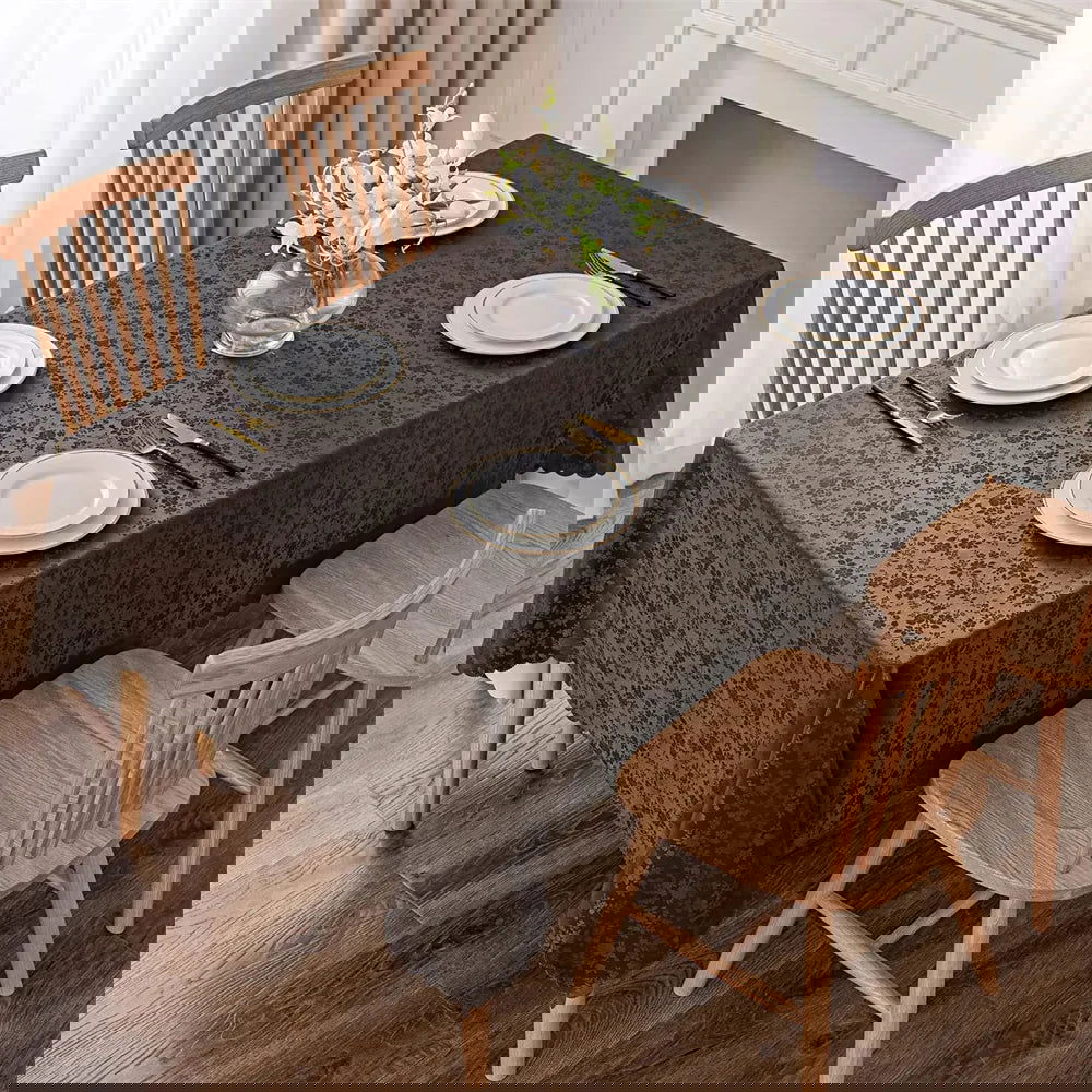 Nappe anti-tâche en polyester enduit marron motif fleuri